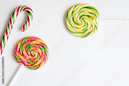 sweets and sugar candies on white background top view