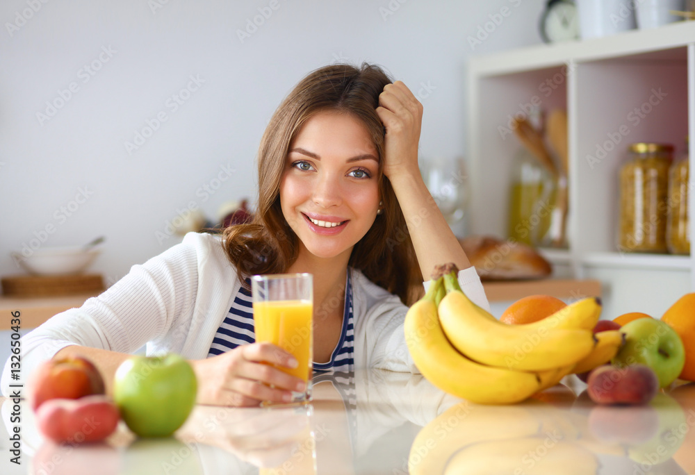 Portrait of a pretty woman holding glass with tasty juice Portrait of a pretty woman holding glass with tasty juice