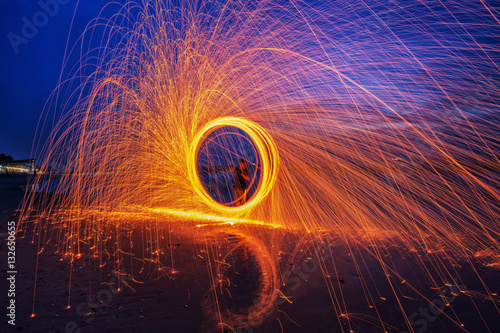 Burning steel wool spinned