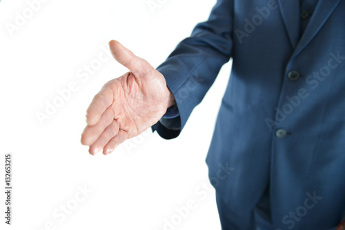 Business man holding out hand for a handshake