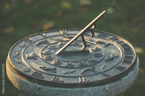 Sundial during sunset, time concept