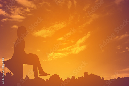 Women sitting alone waiting for someone silhouette.