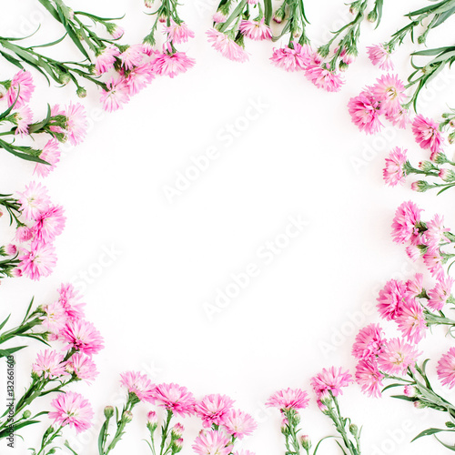 Wreath frame made of pink wildflowers, green leaves, branches on white background. Flat lay, top view. Valentine's background © Floral Deco