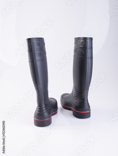 shoe or black color rubber boots on a background.