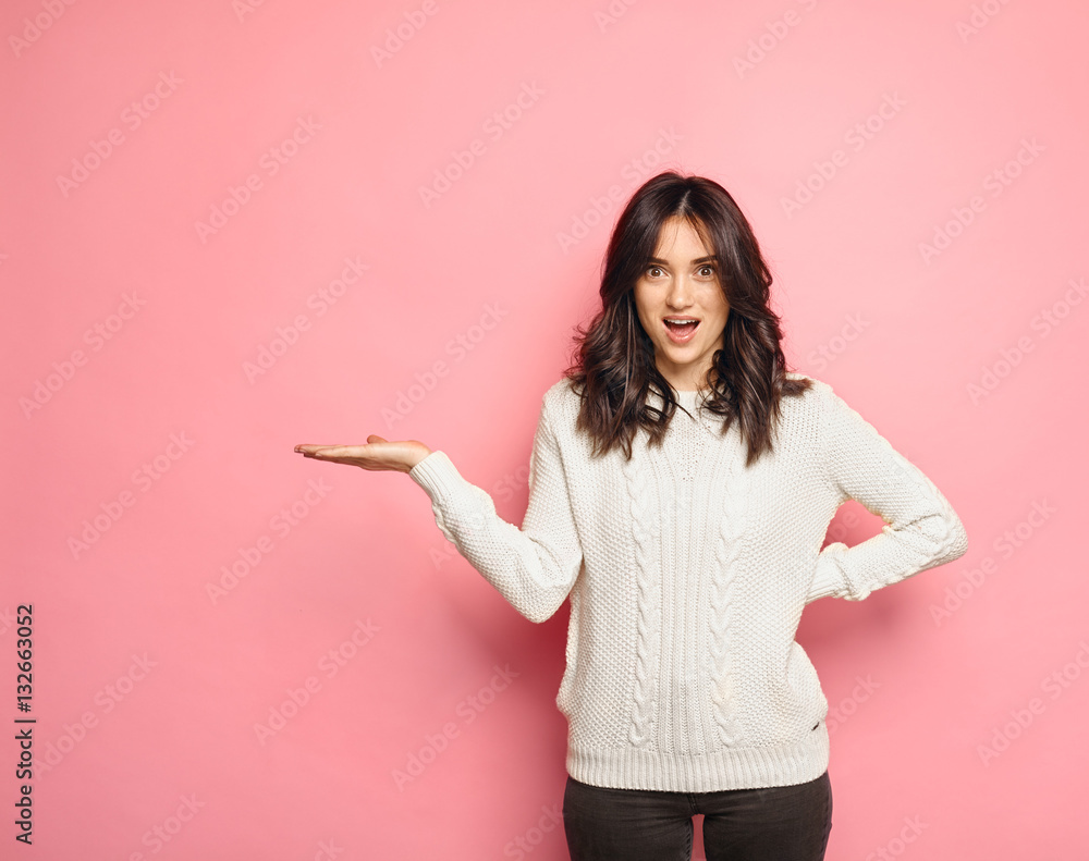 Surprised brunette model Girl showing empty copy space Surprised brunette model Girl showing empty copy space