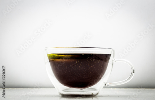 Fototapeta Naklejka Na Ścianę i Meble -  transparent Cup of tea on white background
