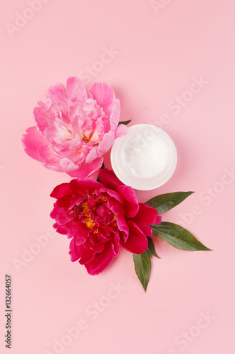 cosmetic creams with pink flowers