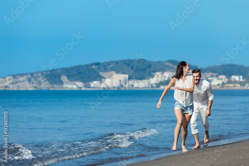 happy couple running on the beach © FS-Stock