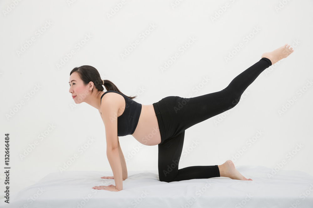 Pregnant Woman Practicing Pilates for back pain Pregnant Woman Practicing Pilates for back pain