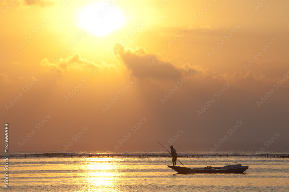 fisher man on boat in sunset bali fisher man on boat in sunset bali