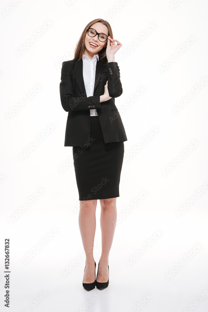 Portrait of smiling young business woman in jacket standing Portrait of smiling young business woman in jacket standing