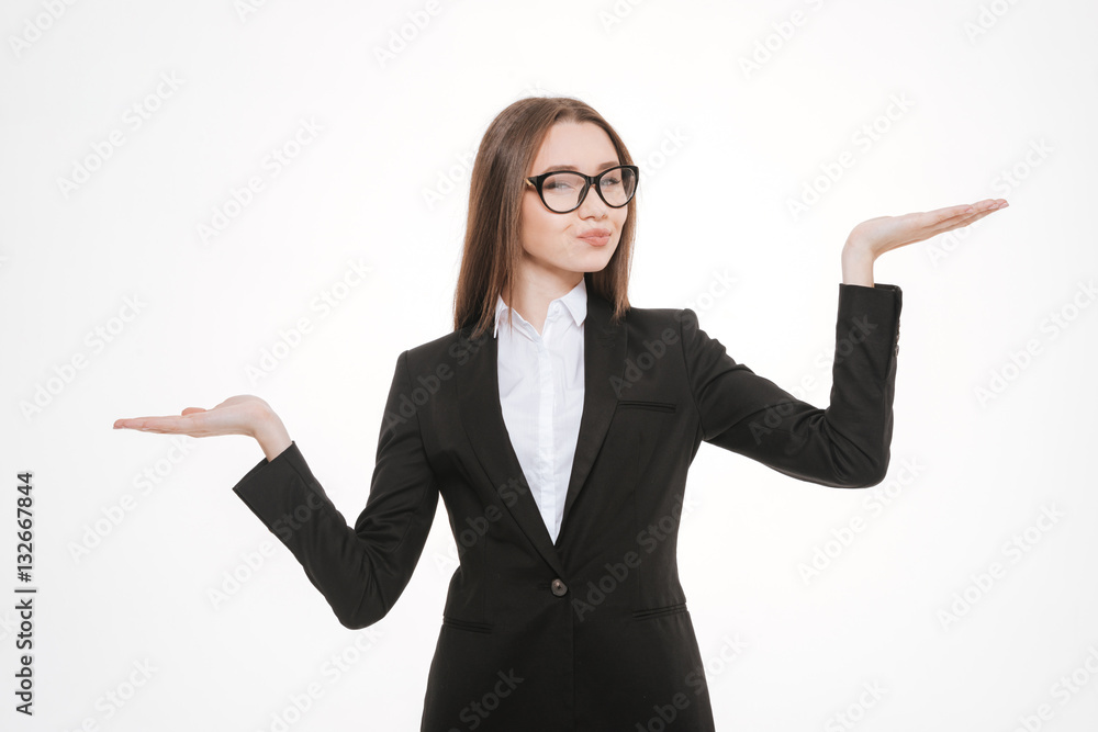 Young business woman holding hands like a libra Young business woman holding hands like a libra