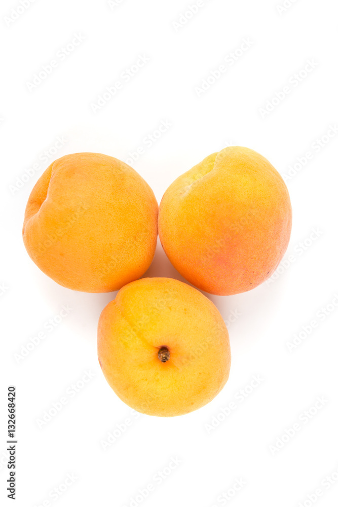 Whole ripe apricots isolated on a white background Whole ripe apricots isolated on a white background