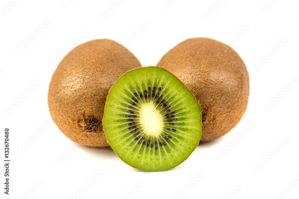 Whole and cut ripe kiwi isolated on a white background Whole and cut ripe kiwi isolated on a white background