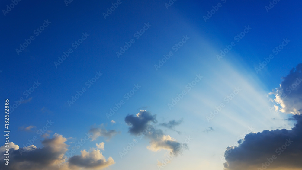light rays on clear blue sky background light rays on clear blue sky background