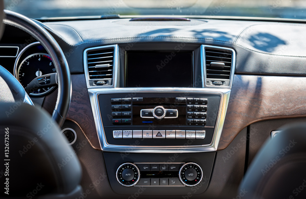 Car interior luxury. Beige comfortable seats, steering wheel, da Car interior luxury. Beige comfortable seats, steering wheel, da