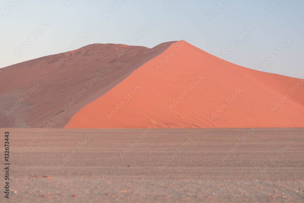 Colorful sunset over the Namib desert, Namibia, Africa. Scenic sand dunes in backlight in the Namib Naukluft National Park, Swakopmund. Colorful sunset over the Namib desert, Namibia, Africa. Scenic sand dunes in backlight in the Namib Naukluft National Park, Swakopmund.