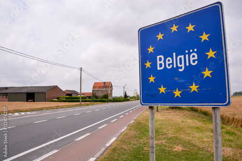Road sign indicating the border of Belgium