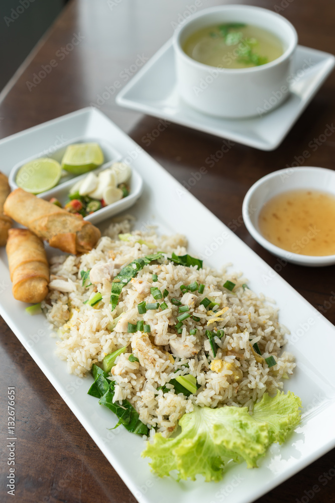 Fried rice with salted fish and fried spring rolls. Fried rice with salted fish and fried spring rolls.