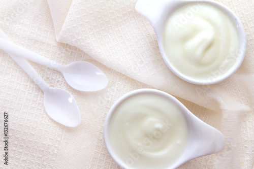Close up natural creamy white yogurt in cup