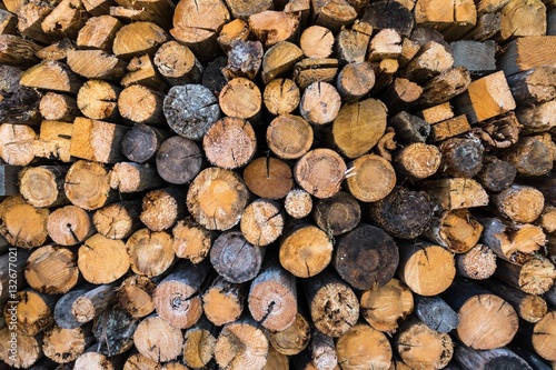 Chopped firewood  stacked woodfuel  fuelwood texture. Natural wooden background.