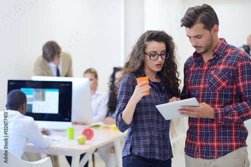 Tableau sur toile young startup business people, couple working on tablet computer