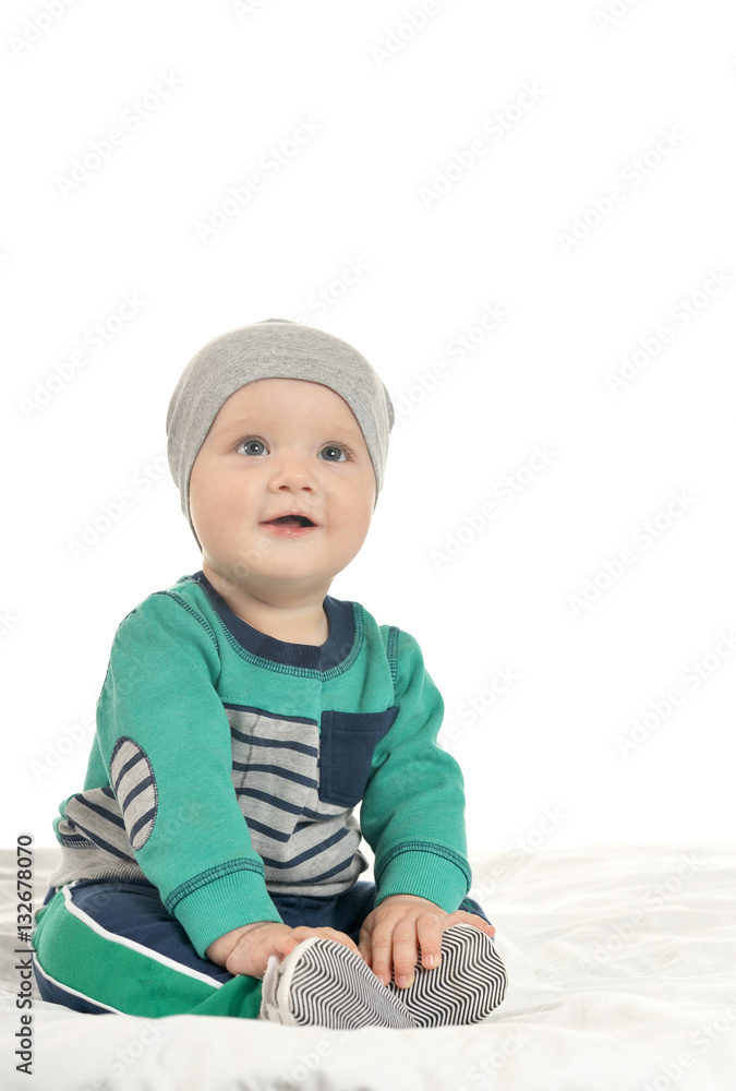 Baby boy sitting on a white background Baby boy sitting on a white background
