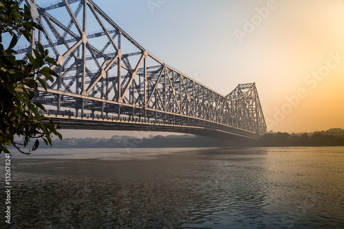Howrah bridge on river Ganges on a foggy winter morning. Kolkata, India.
