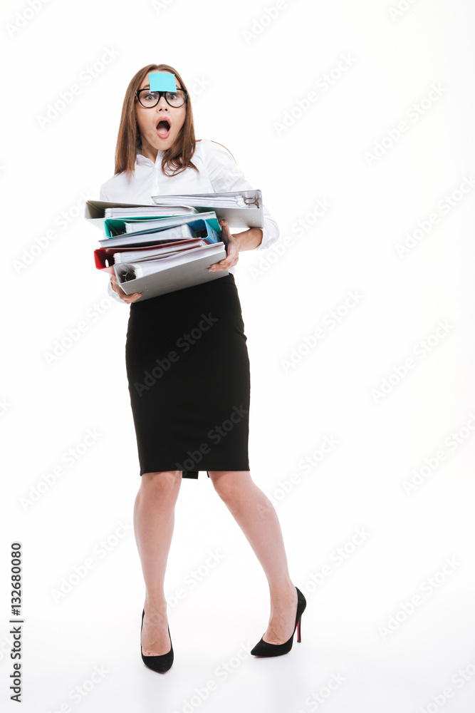 Business woman with sticker on her forehead holding folders Business woman with sticker on her forehead holding folders