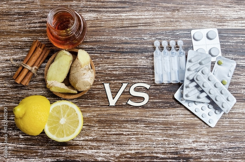 Fotografie Ginger, lemon, honey and  different drugs on wooden background