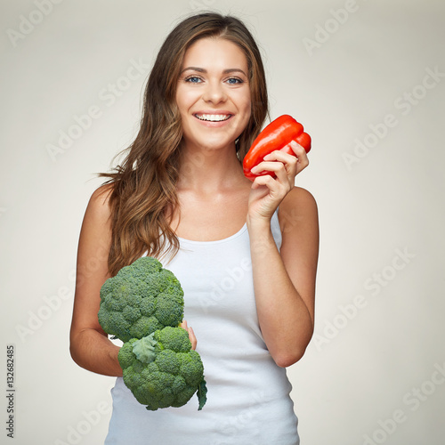 smiling woman holding vegetabless. photo