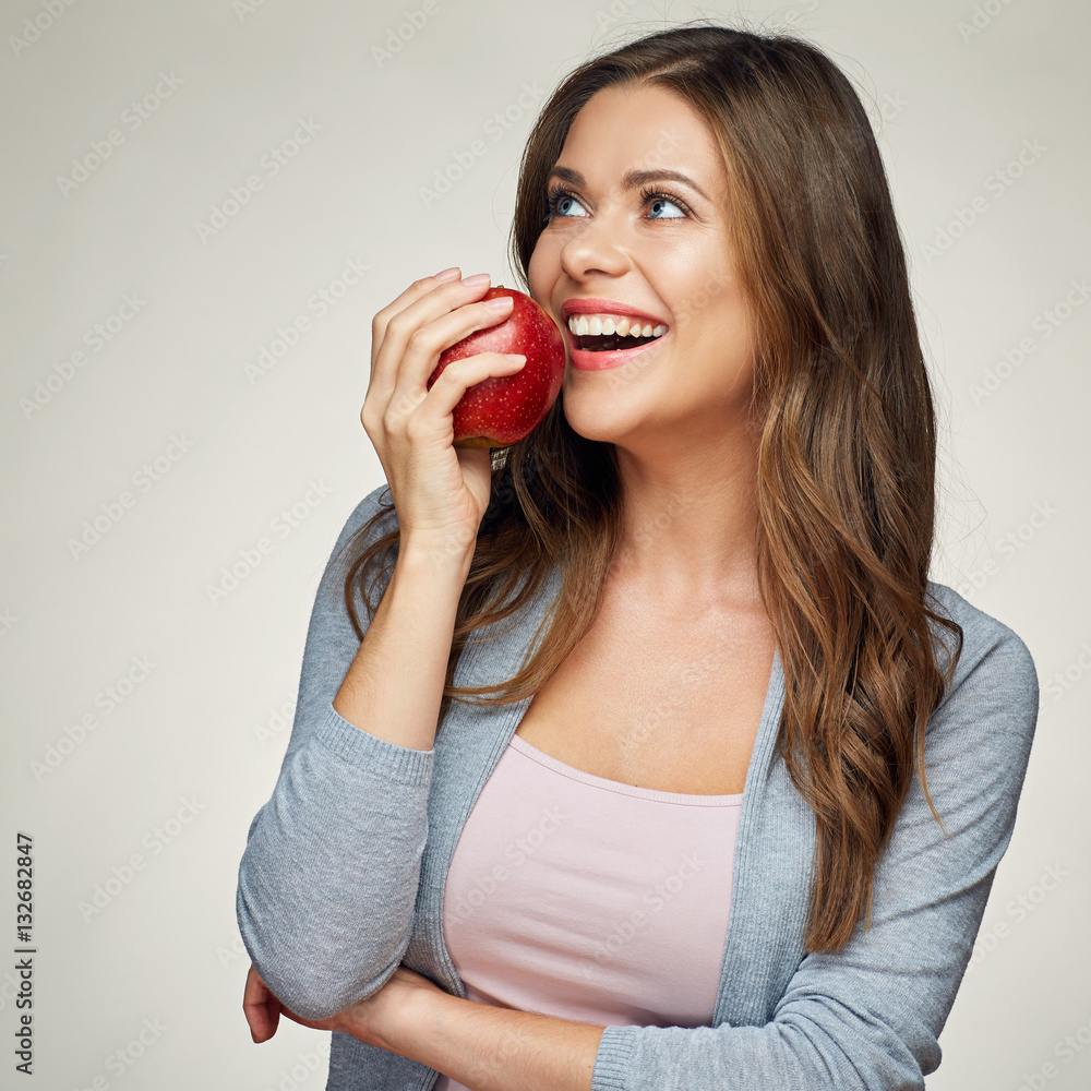 smiling woman with healthy teeth holdinh red apple. smiling woman with healthy teeth holdinh red apple.