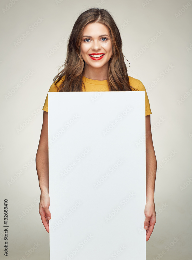 © Yuriy Shevtsov - smiling woman holds white advertising sign board. © Yuriy Shevtsov - smiling woman holds white advertising sign board.