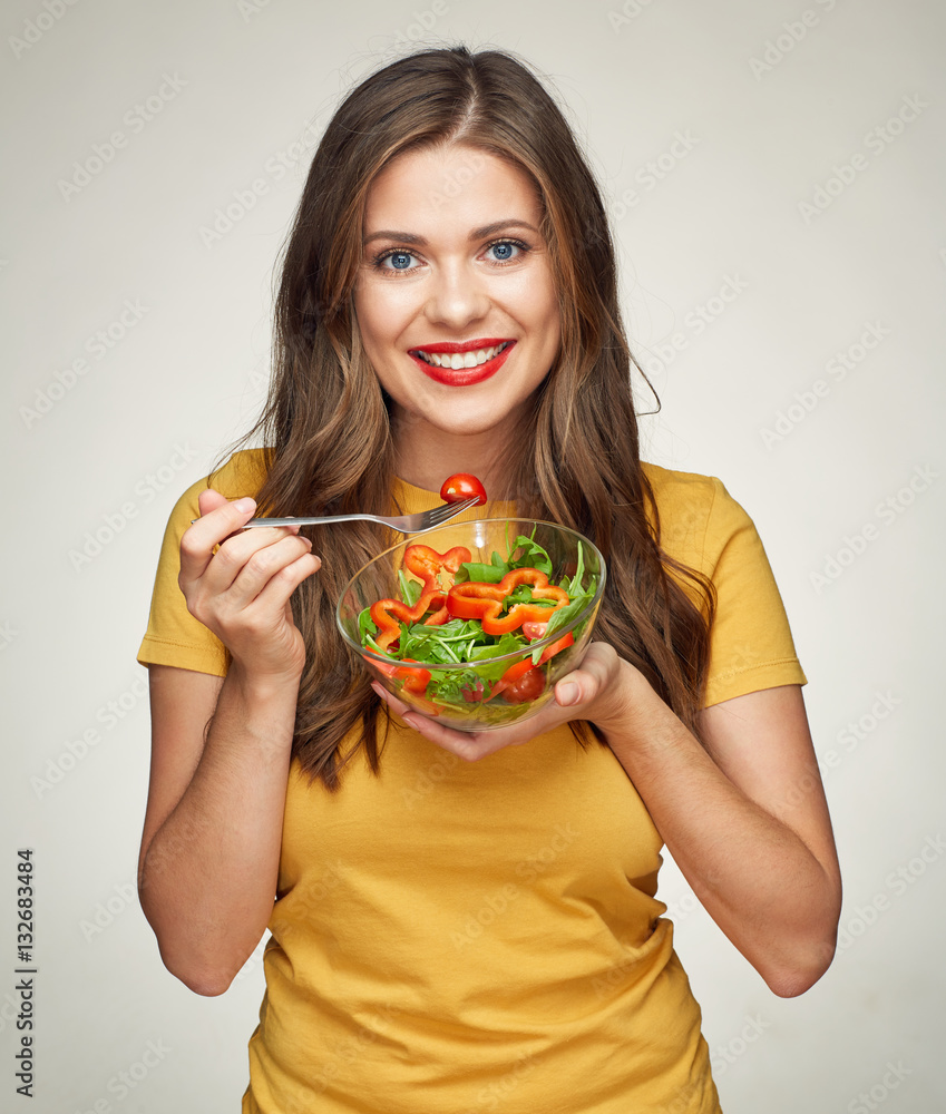 healthy life style with smiling woman eating vegetarian salad. healthy life style with smiling woman eating vegetarian salad.