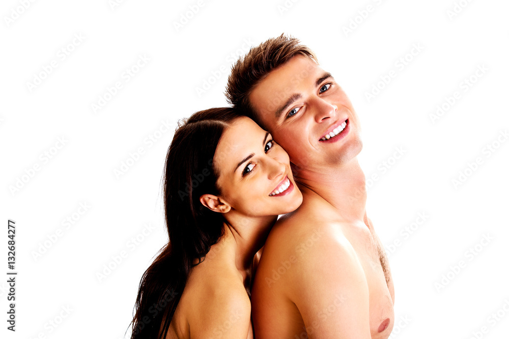 Happy couple hugging and laughing together Happy couple hugging and laughing together