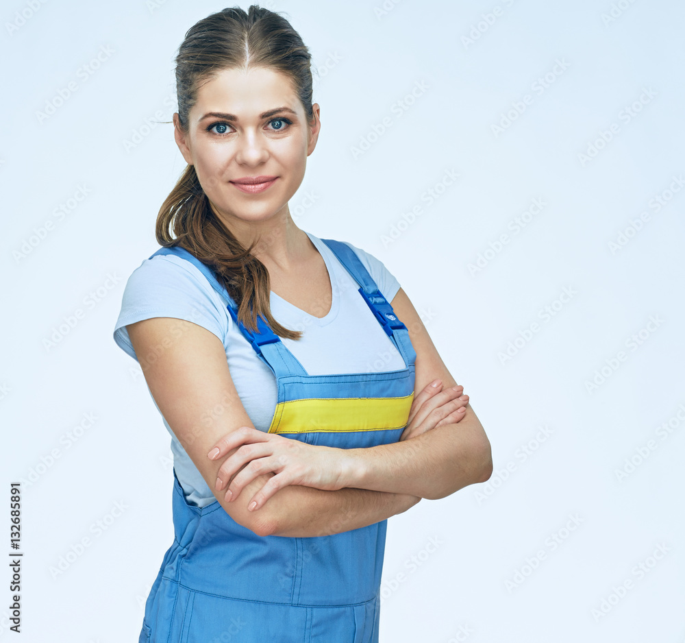Smiling woman repairer wearing coverall.