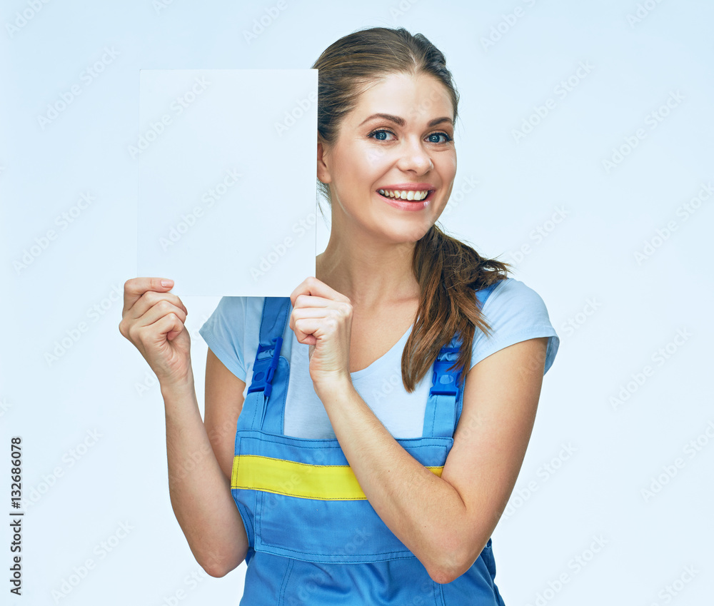 Smiling woman builder holding advertising banner. Smiling woman builder holding advertising banner.
