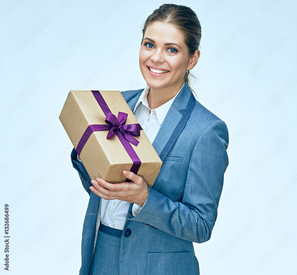 toothy smiling business woman standing with gift box against whi toothy smiling business woman standing with gift box against whi