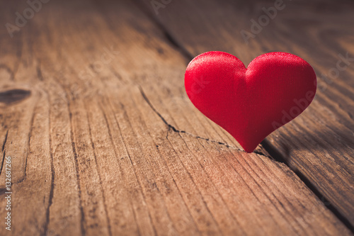 Valentines day. Red heart on wooden background. Copy space