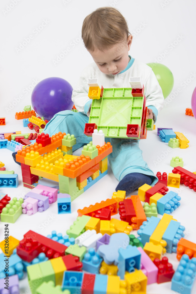 baby boy playing with building blocks baby boy playing with building blocks