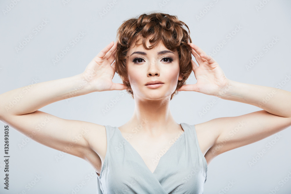 Portrait of young model raised hands. Portrait of young model raised hands.