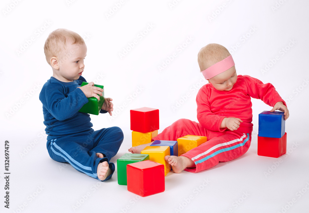 boy and girl playing with cubes boy and girl playing with cubes