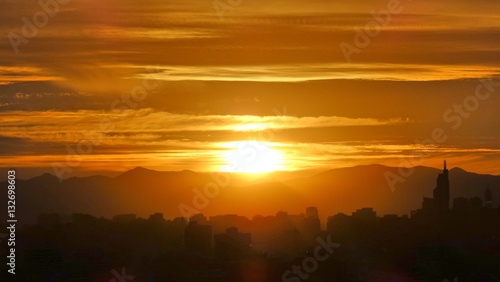 Sunset, clouds, mountains, city landscape in Santiago Chile