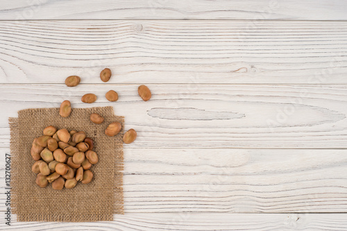 The beans on the old wooden table. Abstract background, empty te