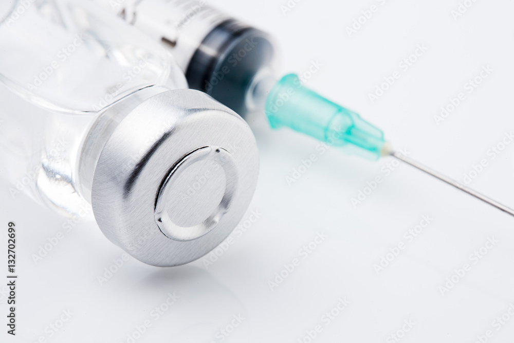 medical ampoules and syringe on white background medical ampoules and syringe on white background