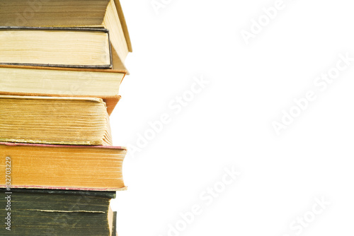 stack of old books isolated on white, close up shot