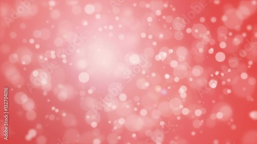 Romantic festive red bokeh background with flickering light particles.