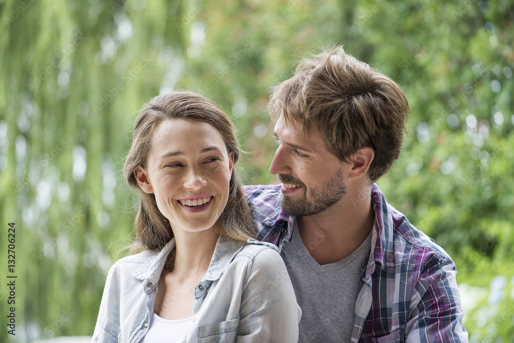 Happy couple enjoying together in a park Happy couple enjoying together in a park