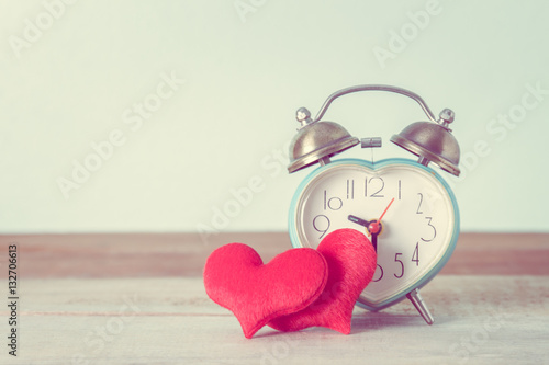 heart alarm clock and heart shape on table, Valentine's Day back