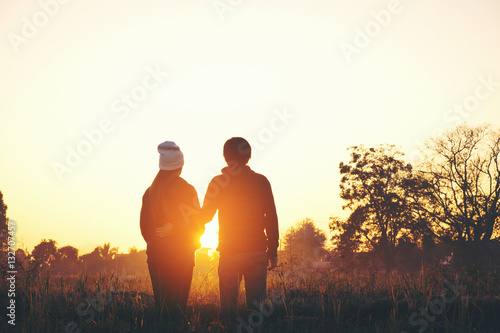 Young couple enjoying the sunset